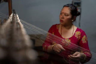Kasmiri cashmere artisan deomonstrating traditional hand-weaving techniques