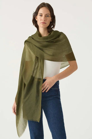 woman wears a featherweight cashmere shawl in olive green | super soft cashmere wraps online Australia