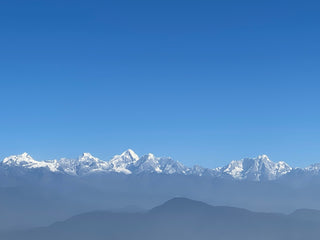Himalayan Mountains snow capped against a blue sky